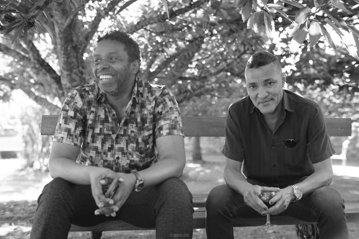 A quiet moment between two musicians — Rich Brown (left) and Sean Rickman (right). Music isn’t just what they play, it’s who they are.

#JazzPhotography #RichBrown #SeanRickman #Dimicology #JazzGroove 
#BlackAndWhitePortrait #JazzMu